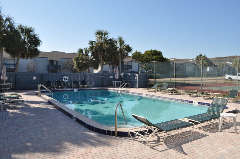 Community pool located 10 feet out back door.