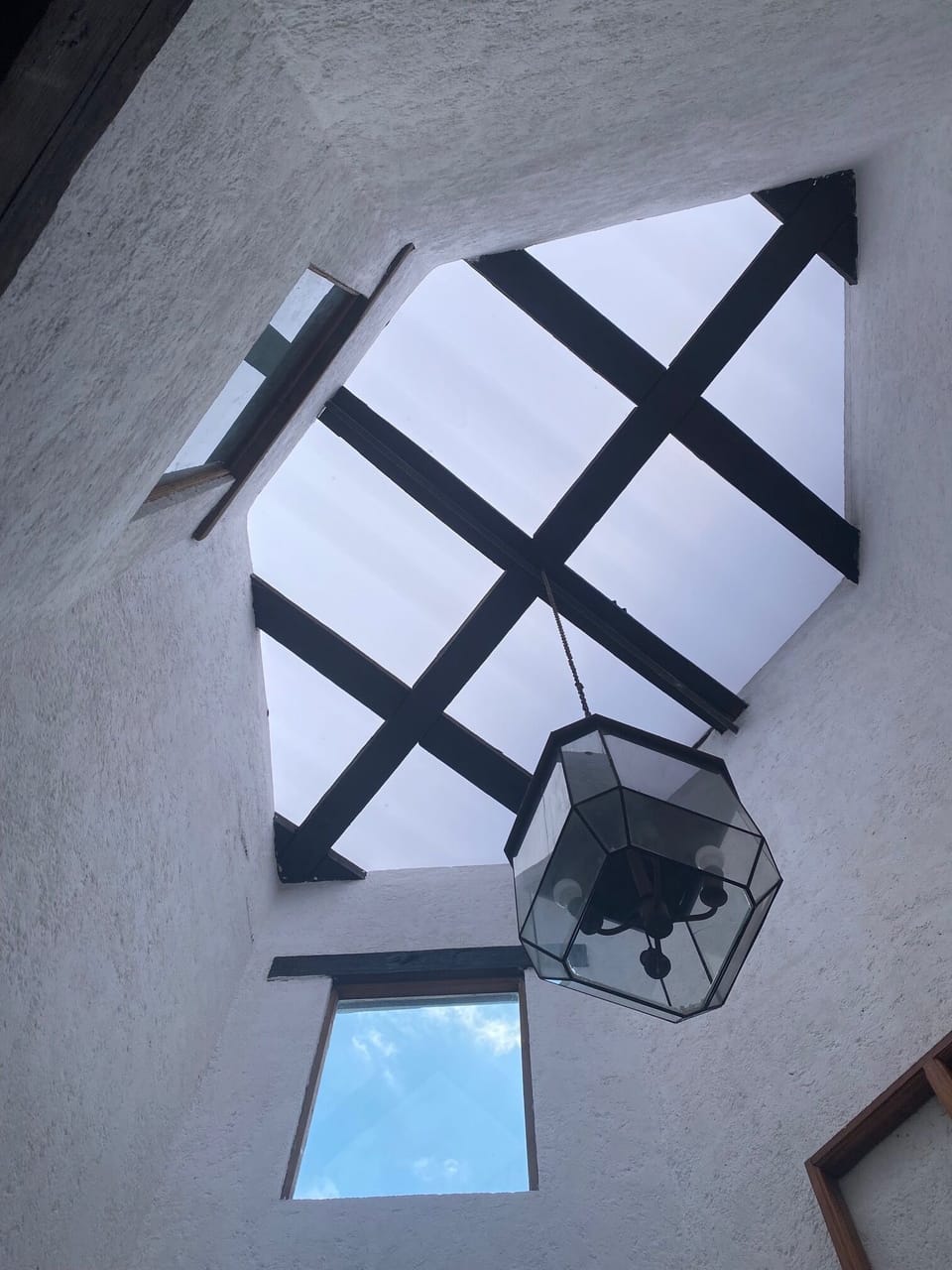 Skylight in kitchen with antique wood beams.