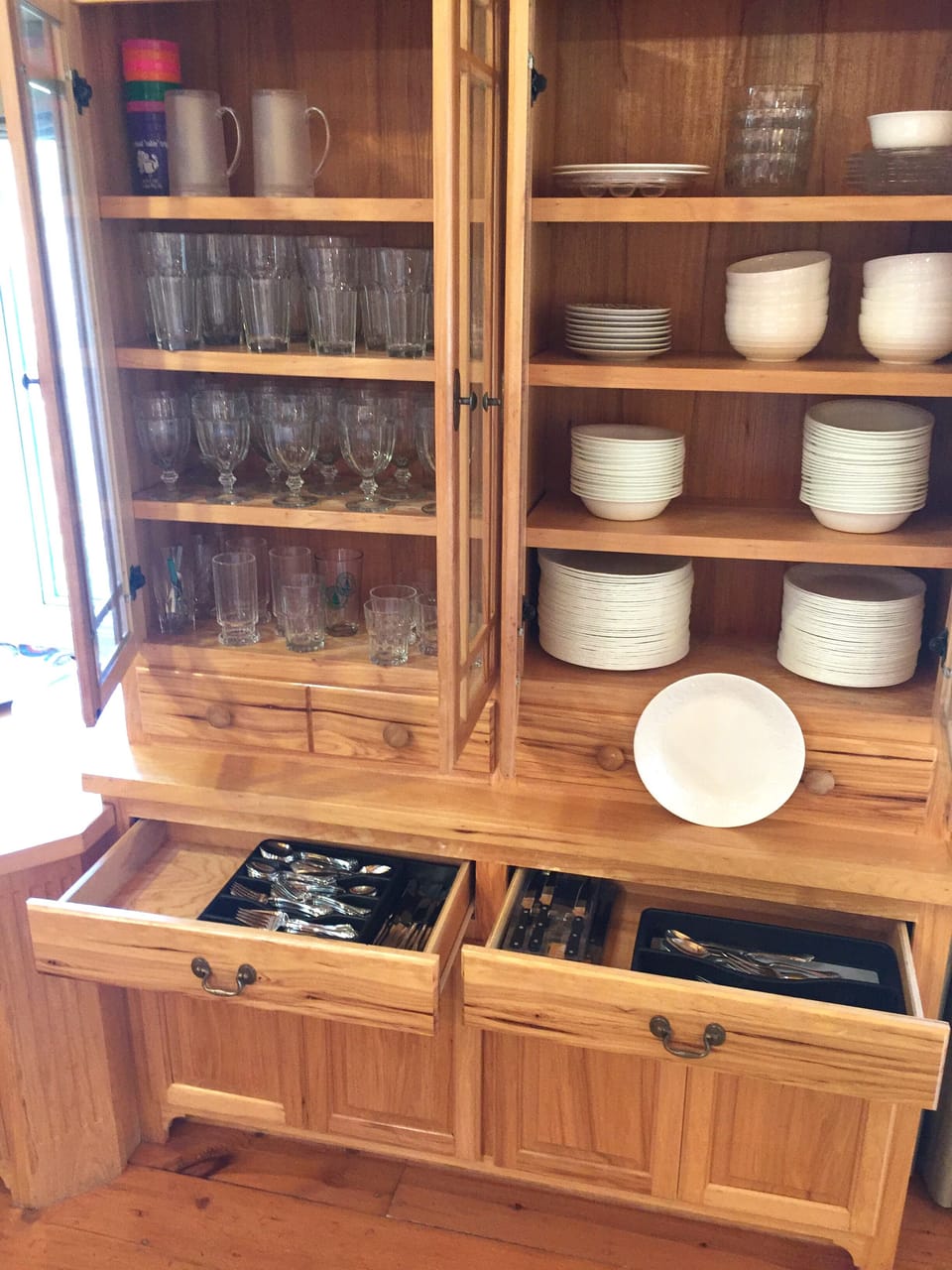 Matching new white dishes , glasses, silverware .