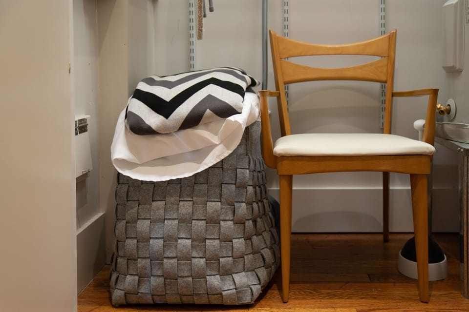 sleeper sofa comforter and pillows in hallway closet