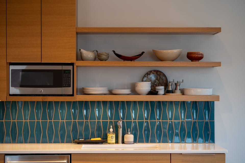 Microwave over kitchen sink and shelves