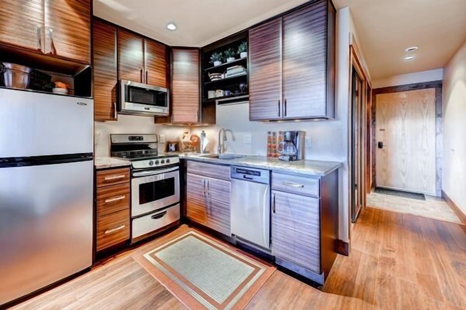 Fully equipped kitchen with standard 12 cup coffee maker and microwave