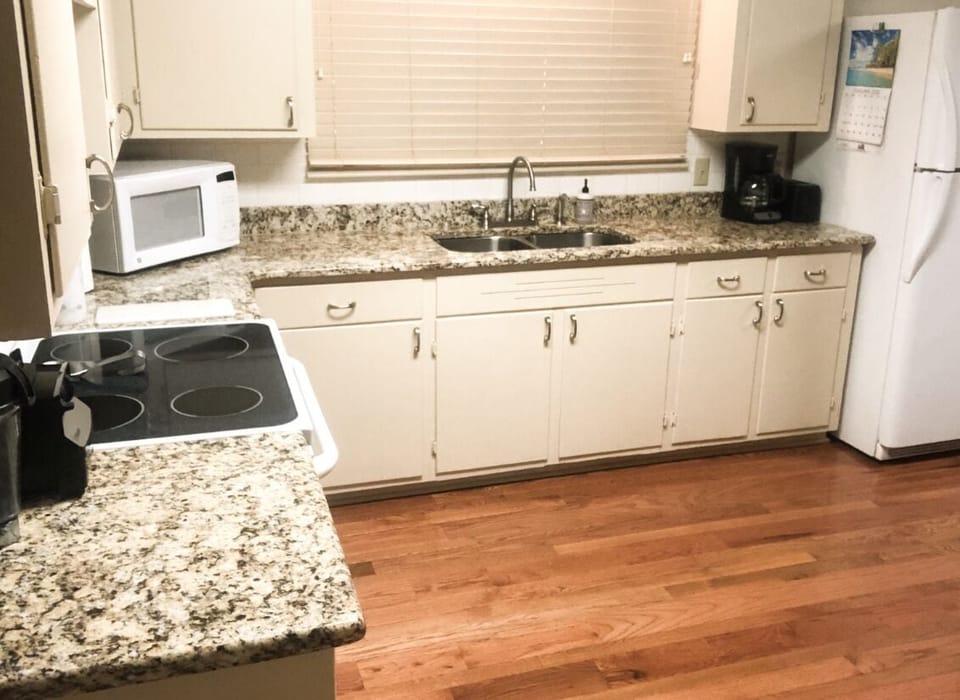 The kitchen is stocked with a toaster, coffee maker, Vitamix blender, microwave.