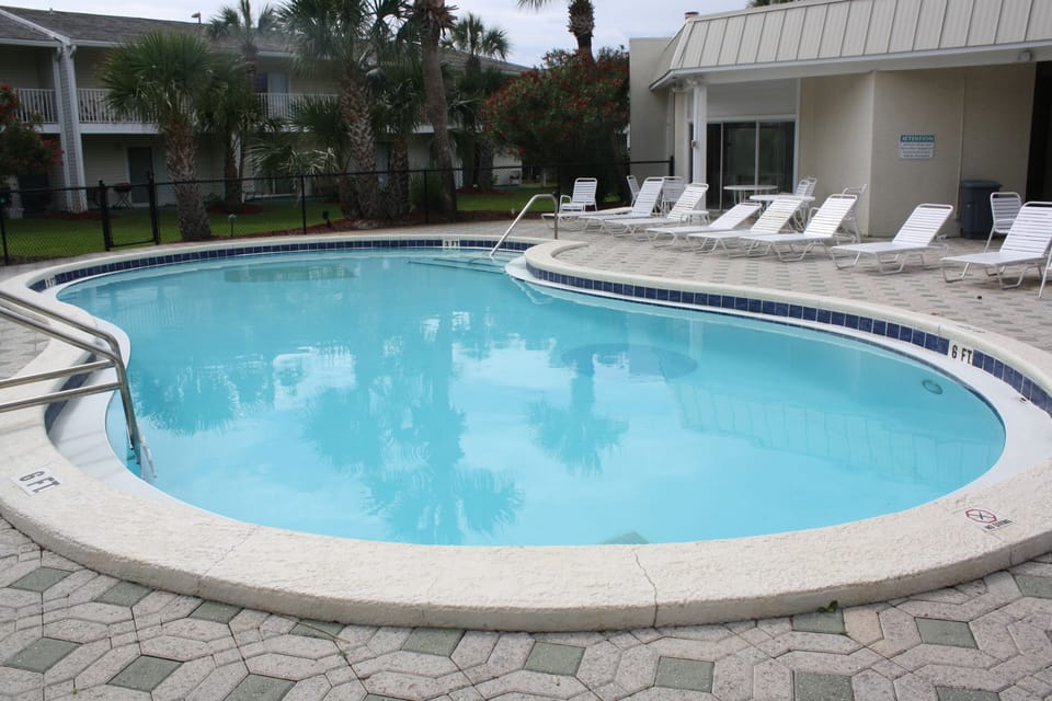 Gorgeous tropical pool is clean and newly renovated. Lots of seating & bathrooms
