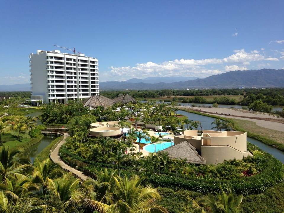 View of Grand Luxxe Residence Tower - mountains in background and Kid's club 
