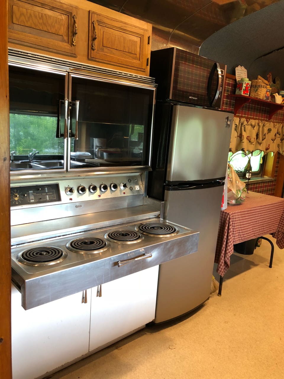 Four burner stove and oven, microwave/convection oven, stainless fridge