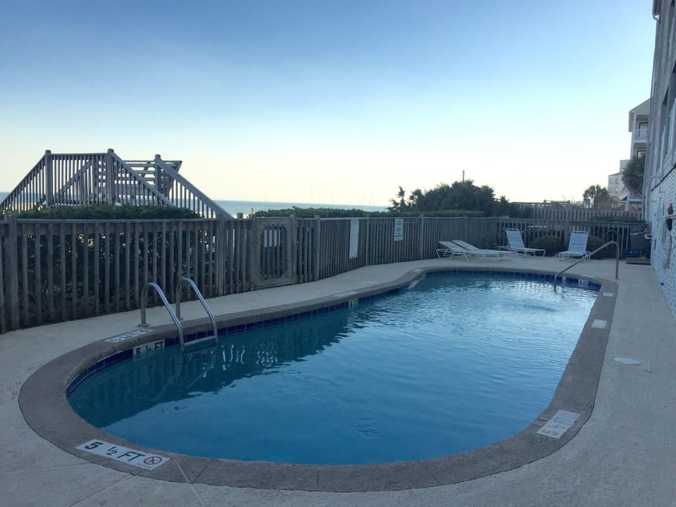 Oceanfront pool behind/below unit