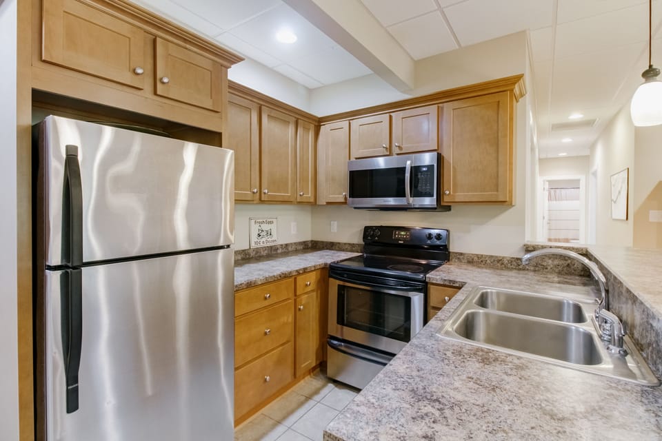 Kitchen has all the cooking and eating basics.