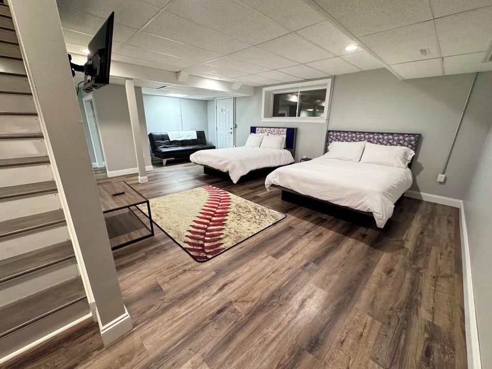 2 Queen beds
1-Futon with electric outlet built into the side.