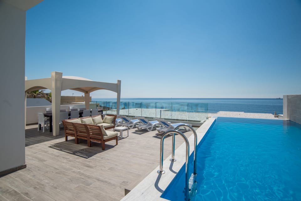 Outdoor Relaxation area with private infinity pool; unobstructed sea views 