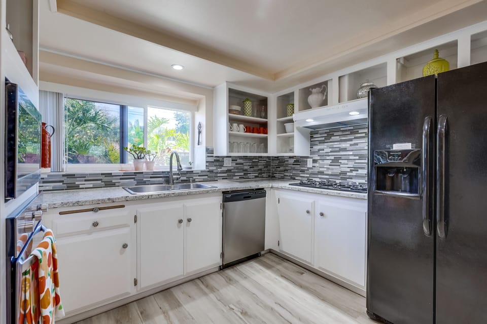 Kitchen is fully stocked, cabinets are open so finding things is easy. 