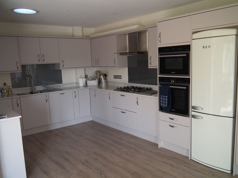 Fully equipped kitchen with sun tunnel.