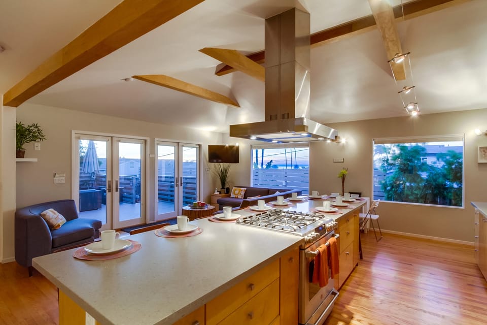 12 at island and 4 at dining side table. 16 total for indoor dining if it rains.