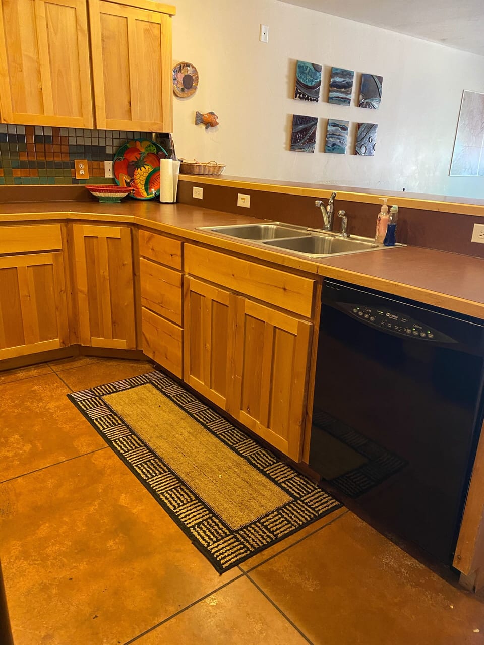 Kitchen includes crock pot, blender, coffee maker, & ample cooking supplies. 