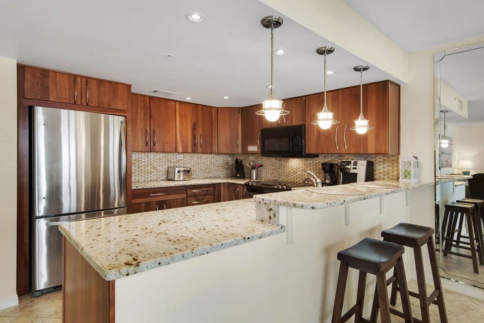 Kitchen with recessed lighting and granite countertops throughout