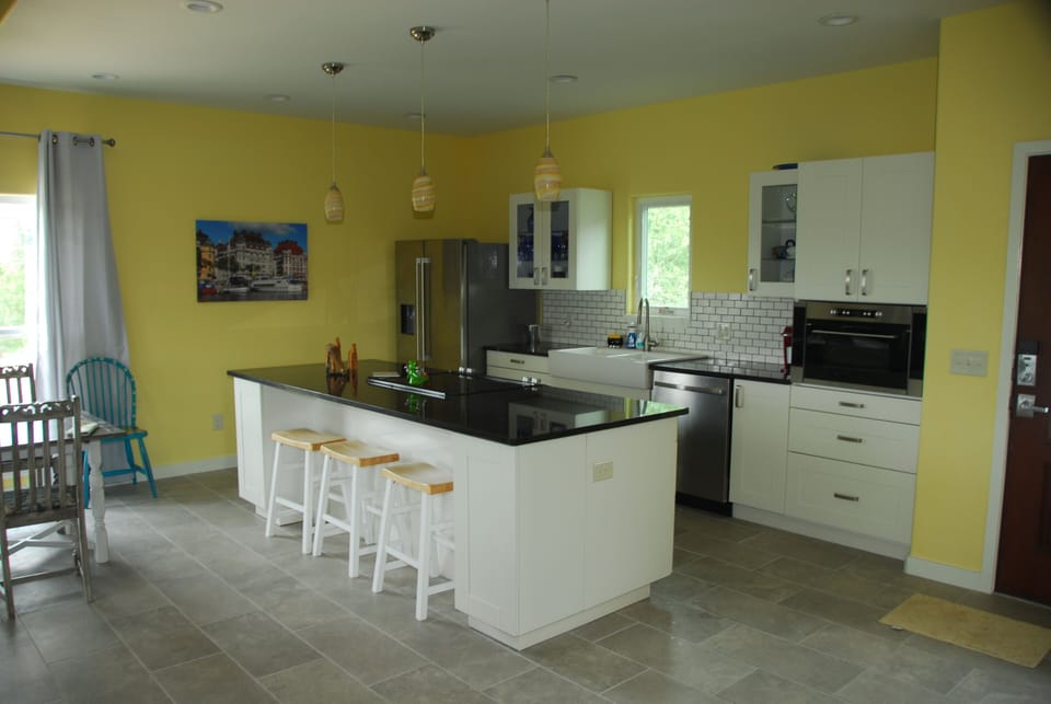 Kitchen with Dishwasher, Micowave, Oven, Stove top, Refrigerator. Much storage