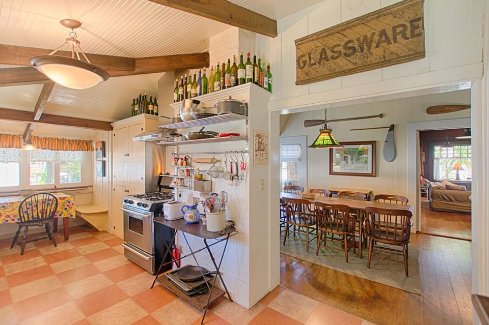 Kitchen on left looking into dining room and living room in distant right