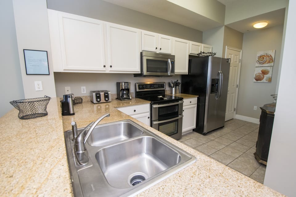 Kitchen with Toaster, Coffee Machine, Dishes and Utensils