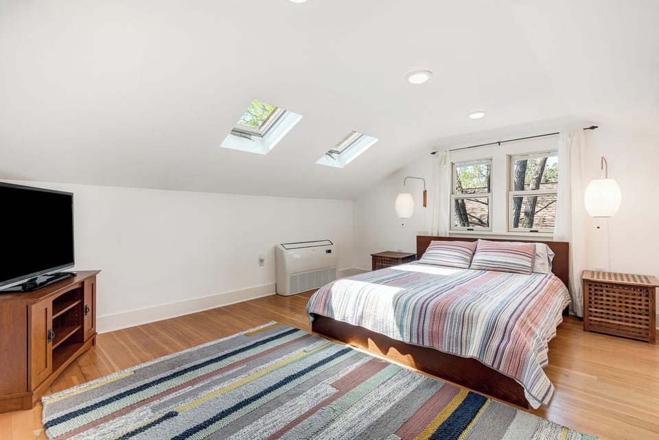 Upstairs bedroom; light and bright with skylights and built in closet