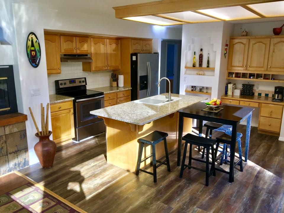 Granite countertops, well stocked kitchen we've got everything you need.