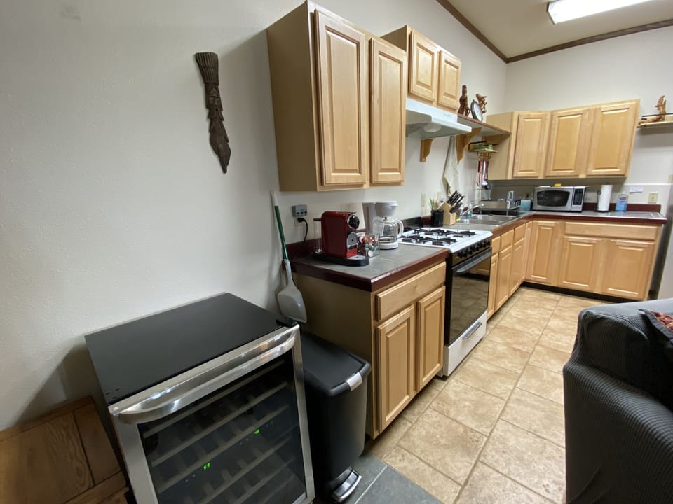 Bear Den has a full kitchen, wine fridge, Nespresso maker. 