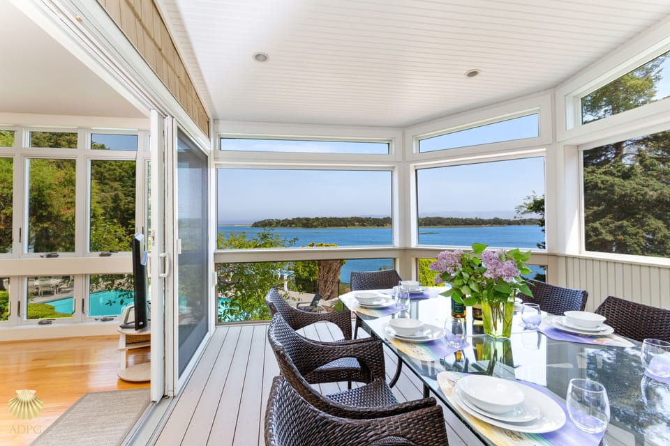 Spacious screened in porch that provides additional dining