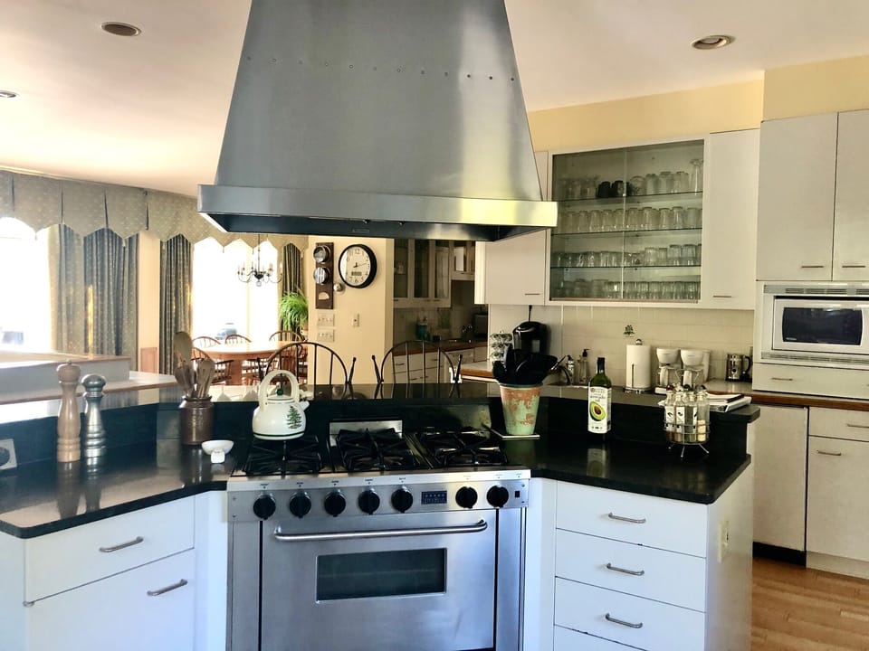 Kitchen looking south with gas stove & oven, there is also a convection oven.