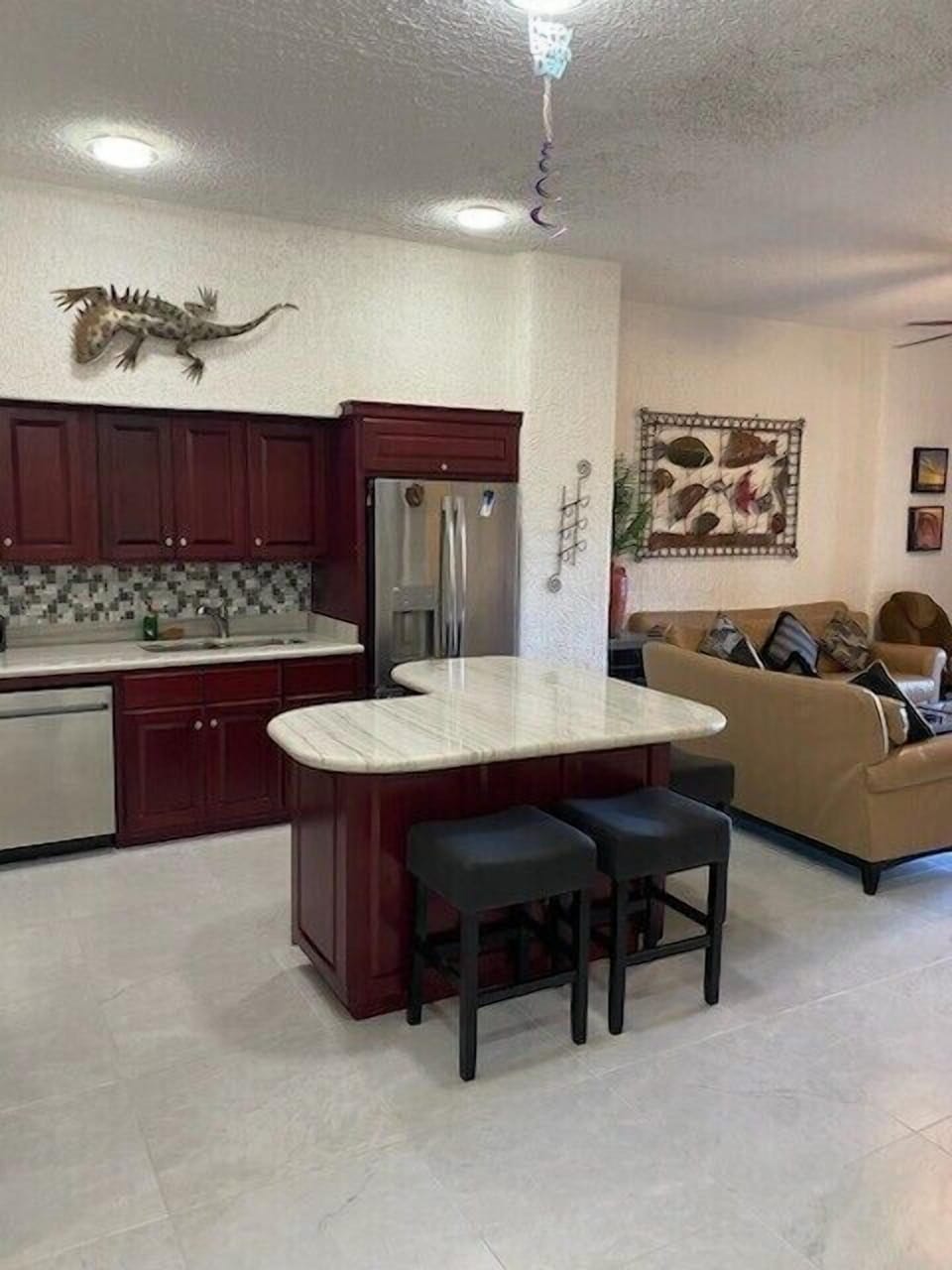 Remodeled kitchen with new flooring.