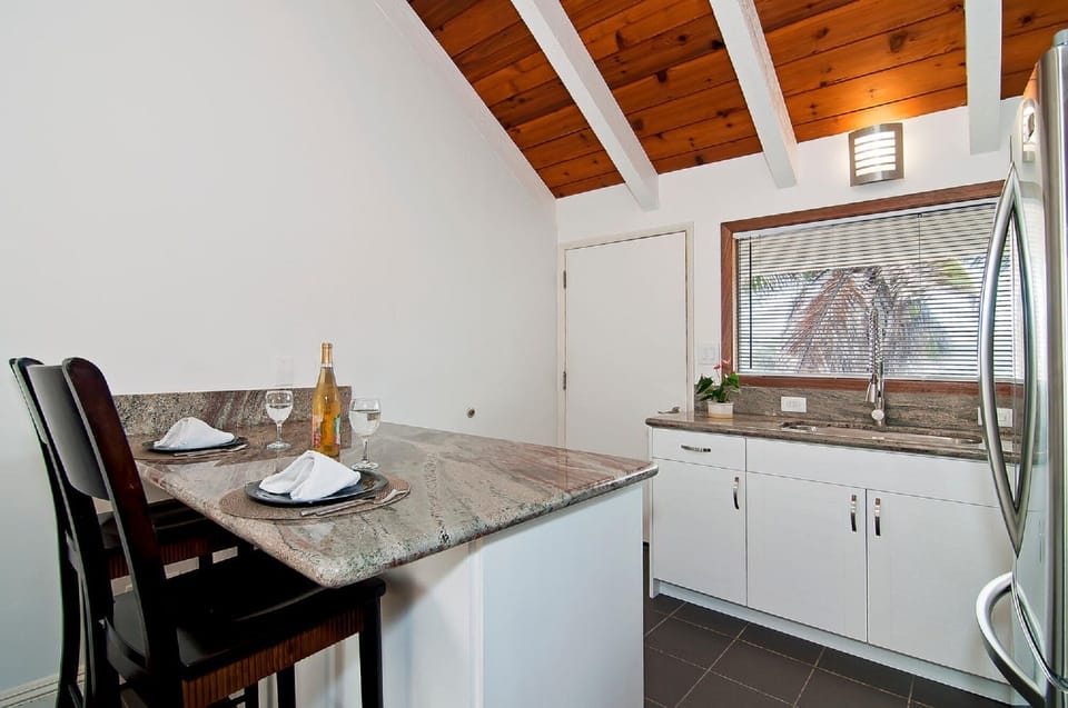 Kitchenette with island and granite countertops 