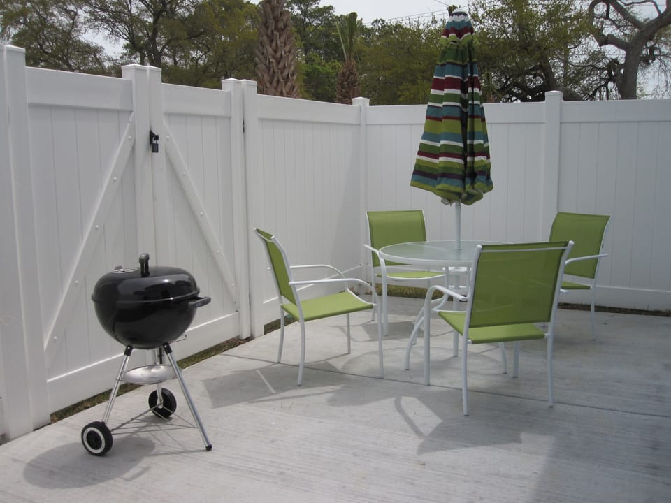 Patio with Table Set, Grill, Beach Chairs and Umbrella