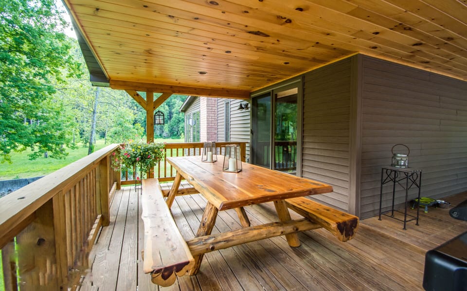 Deck with log picnic table.