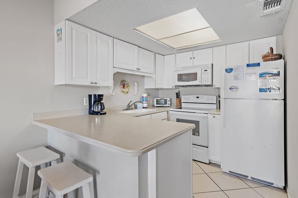 Kitchen with breakfast bar.