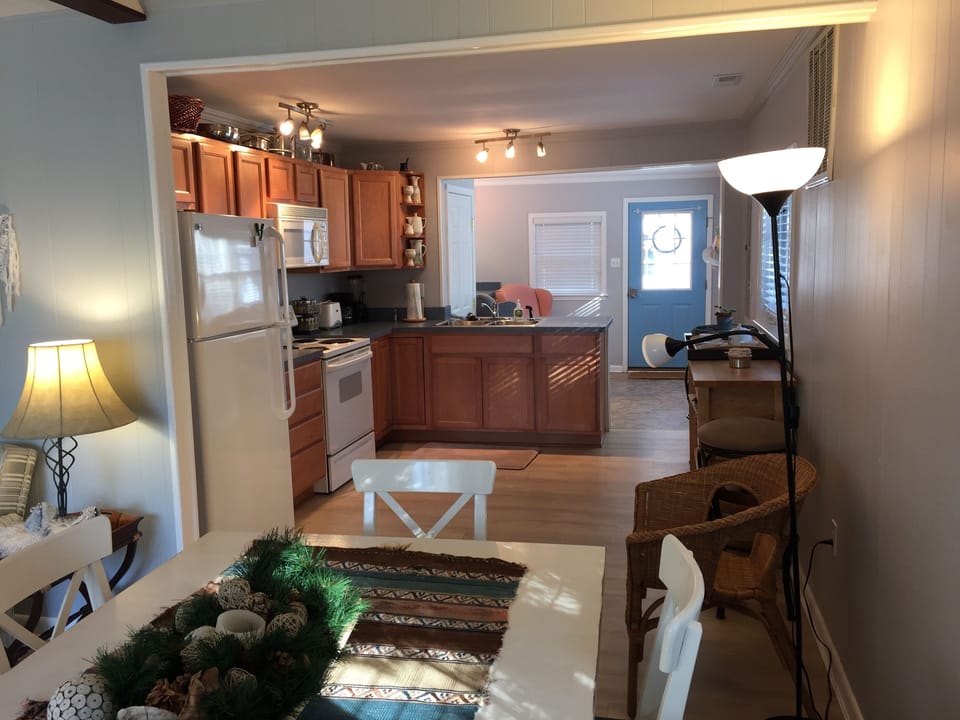 Just beyond the counter is a 2nd teak dinning room Table for puzzles and layout.