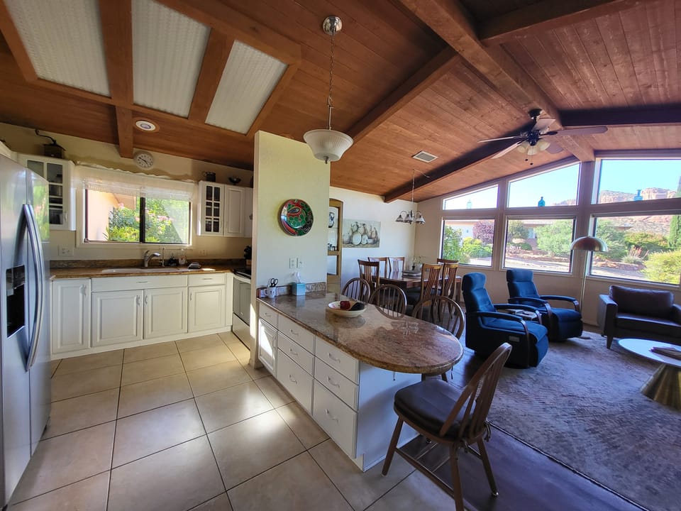 Modern kitchen - open floor plan - low bar seats 4, dining table seats 6