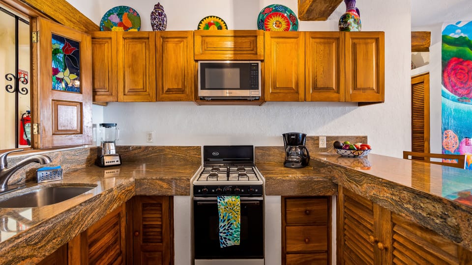 Kitchen has a blender, coffee maker, oven, stovetop, microwave, you name it!