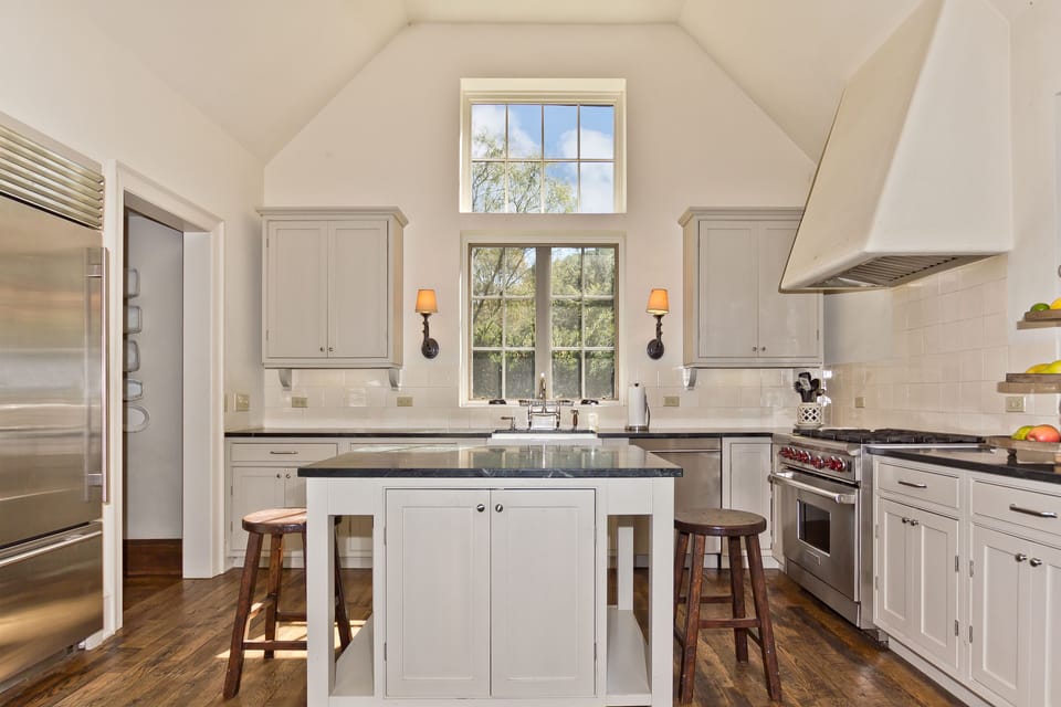 Bright, clean an crisp kitchen, soapstone countertops, high end appliances.