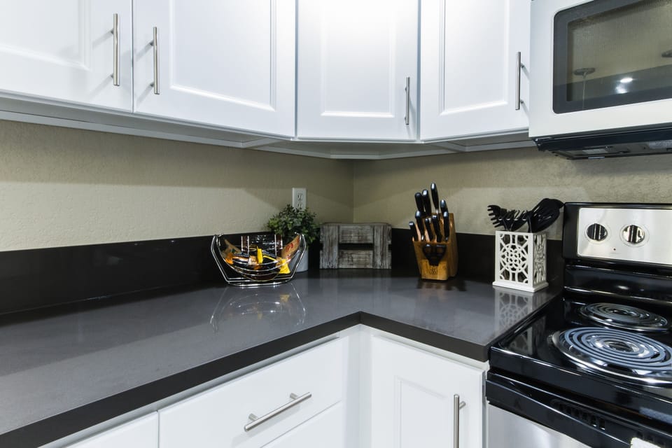 Beautiful white kitchen cabinets and quartz counter tops.  
