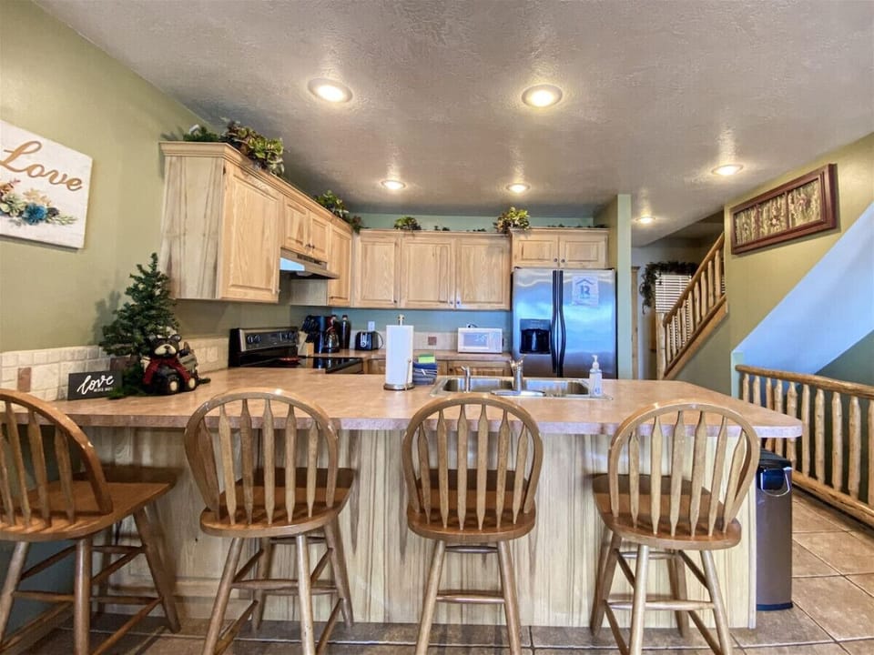 Inviting breakfast bar with seating in open-concept kitchen