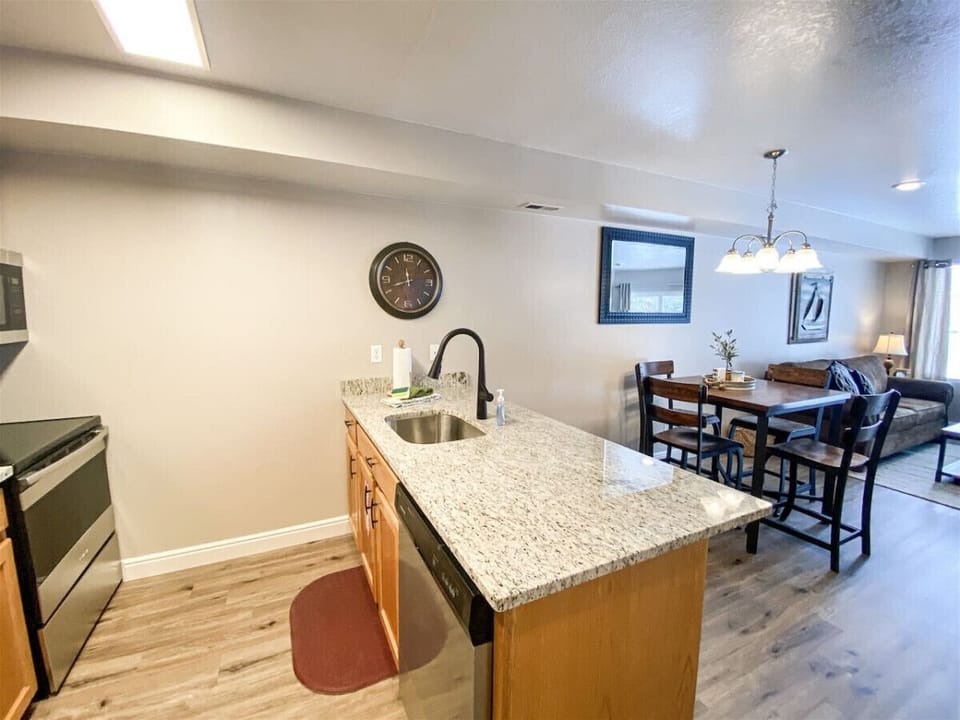 Spacious granite kitchen island perfect for casual dining and entertaining in a warm, cozy setting.
