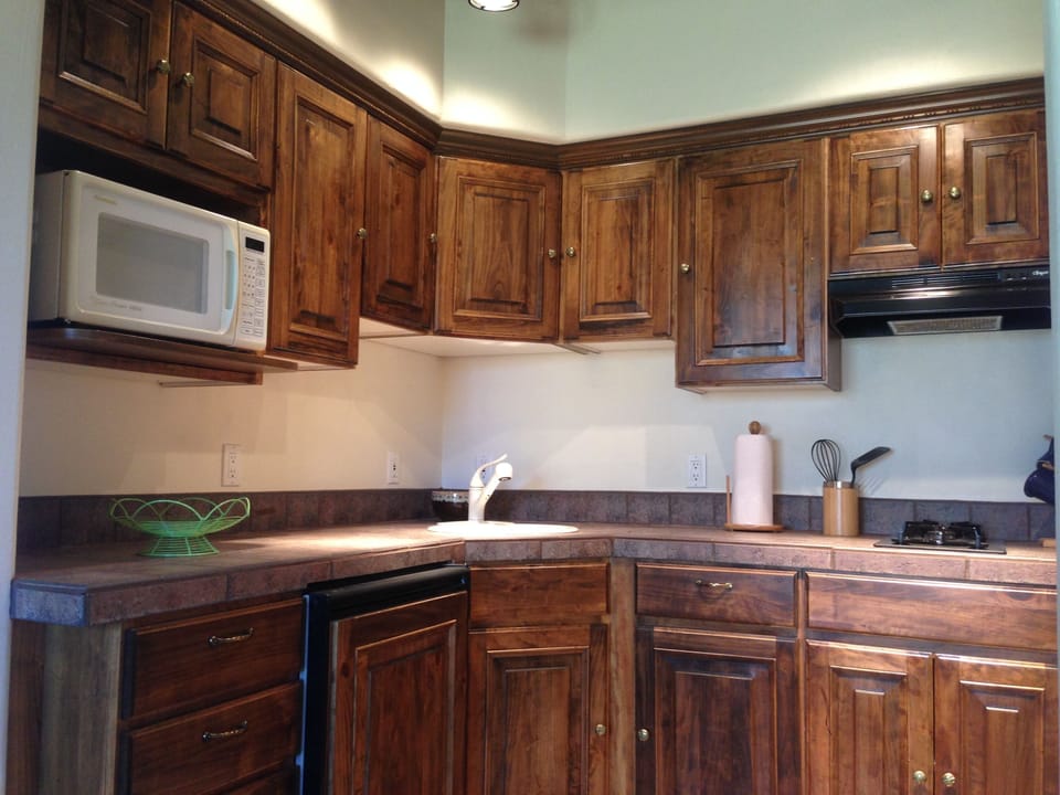 Full kitchen with cook top, microwave, fridge and most utensils. Gas grill also.