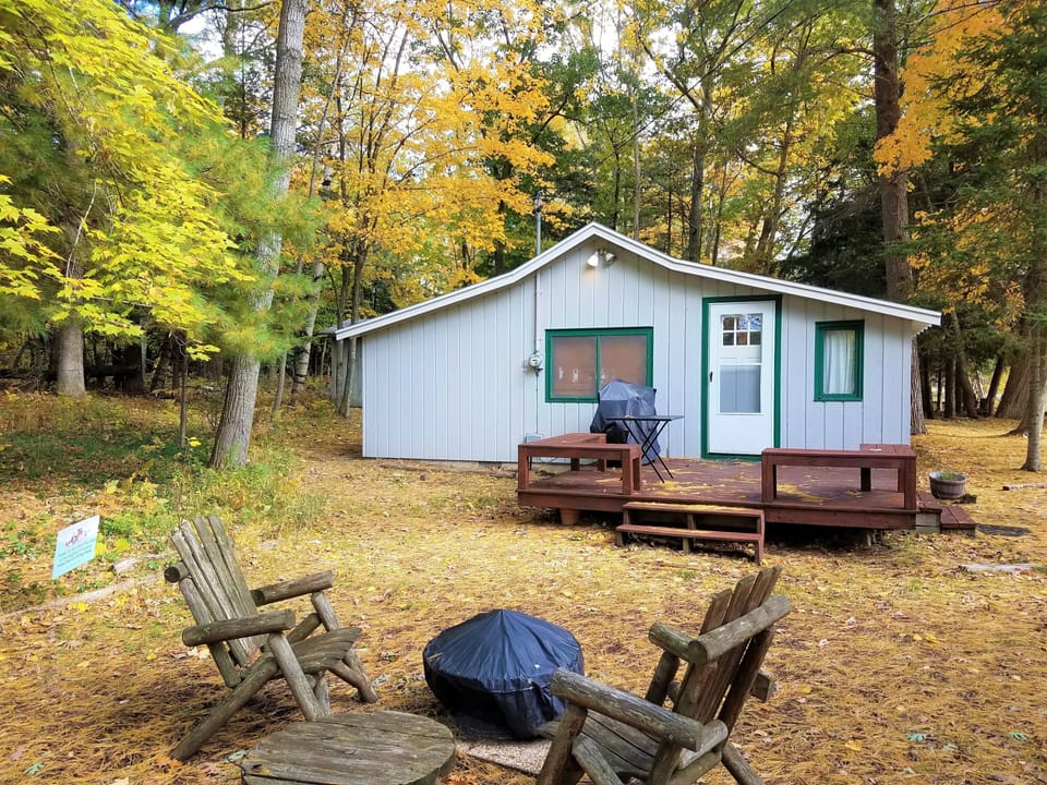 Outdoors - Fire pit, gas grill, deck, outdoor chairs, private river frontage.