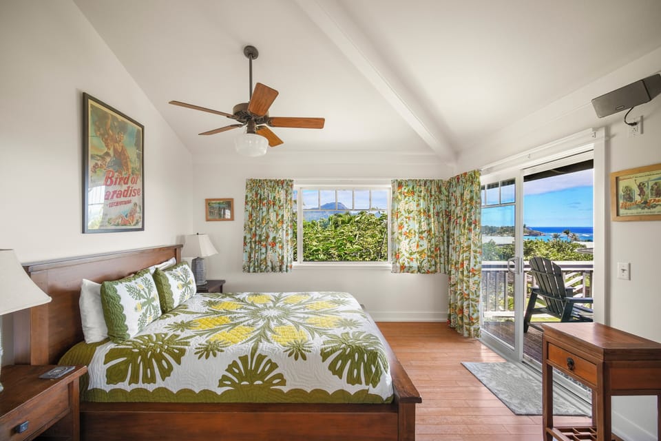 Upstairs primary bedroom with ocean and mountain views