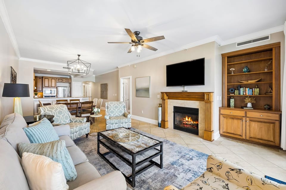 Unwind in your spacious living room, where a cozy fireplace and plush seating invite you to relax after a day of adventure.