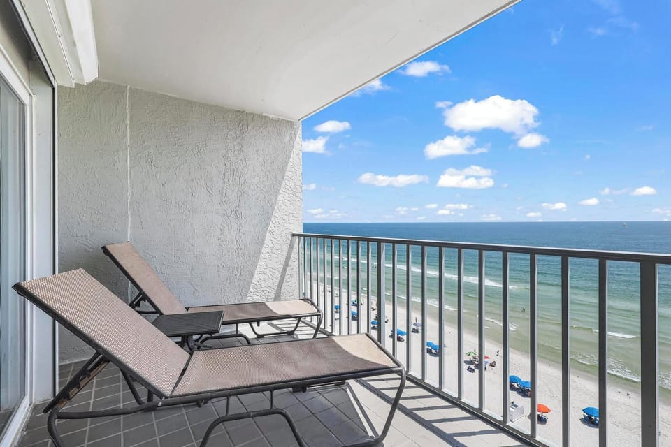Balcony - The spacious balcony offers loungers for enjoying a relaxing morning watching the waves crash on the shore.