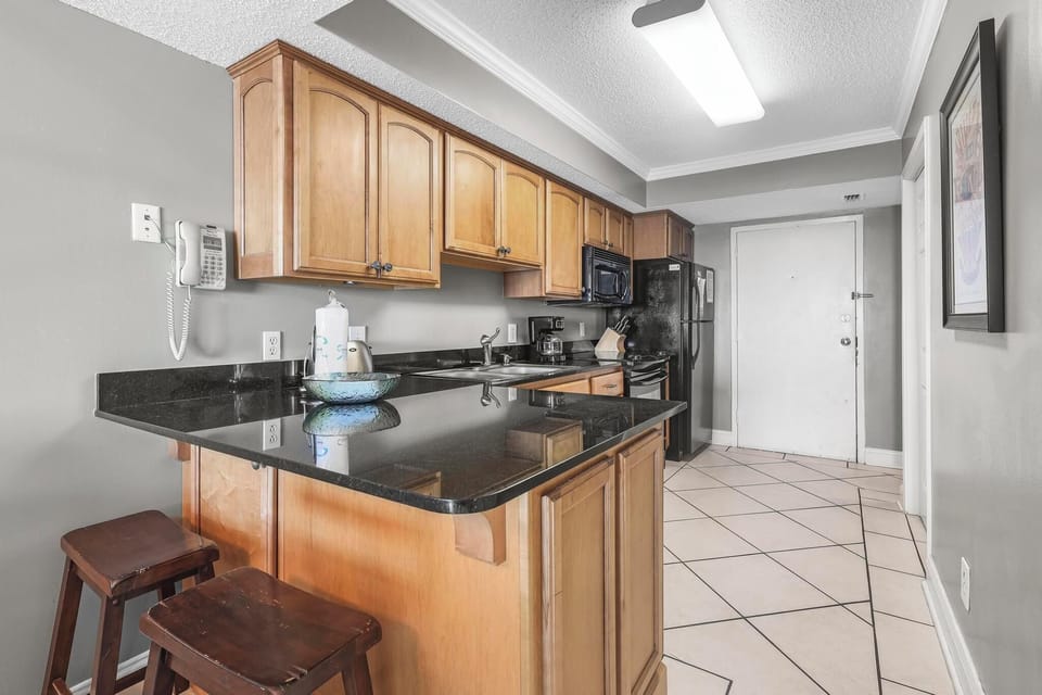 Kitchen - The fully stocked kitchen offers all items needed for preparing your meals during your stay.