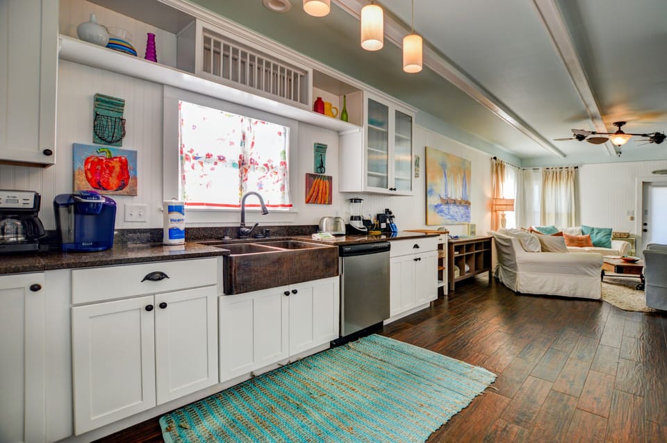 Kitchen - The kitchen offers a dishwasher, built in microwave, stove, oven and a refrigerator/ freezer with ice maker. Fully stocked with pots and pans, utensils and dishes for preparing meals.