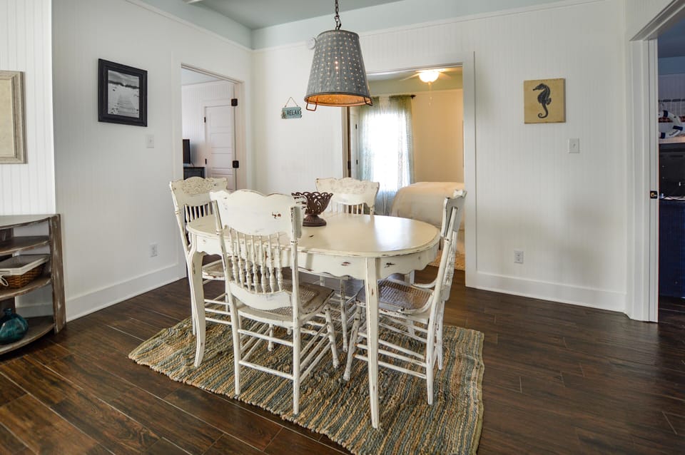 Dining Area - The spacious dining area offers a table with seating for 4. A great space for dining or a family game of cards.