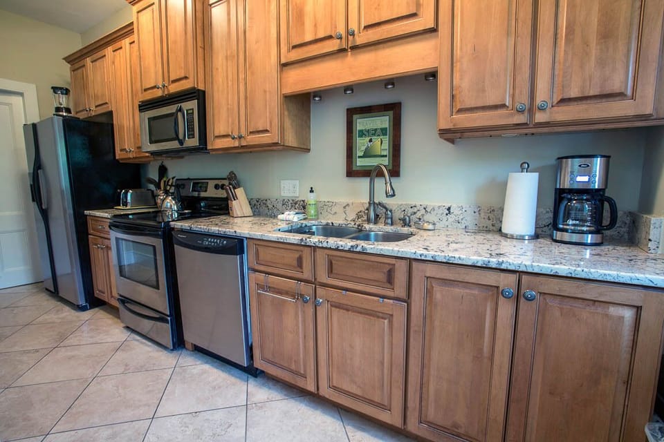 Granite counter tops and stainless steel appliances.