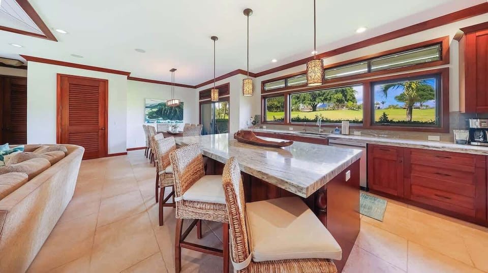 Kitchen features kitchen island for you to gather at while preparing meals