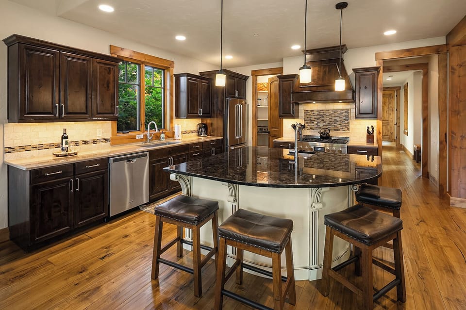 Three Sisters Lodge. - Seating for 4 at the large granite kitchen island.